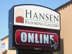 Custom illuminated sign cabinet on a pole structure