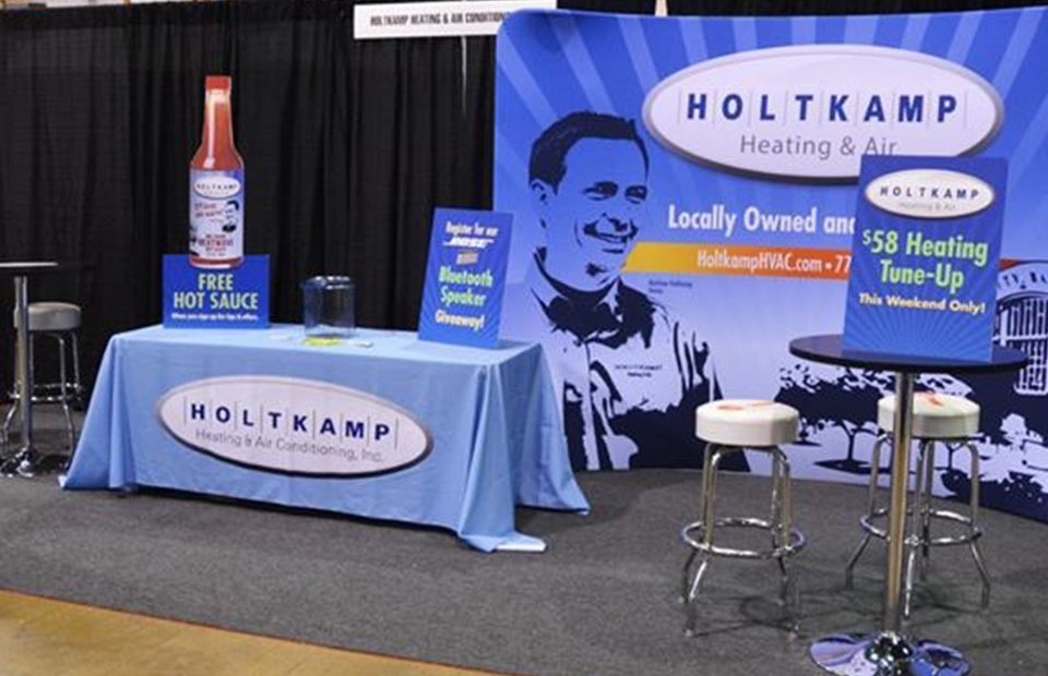 Coordinated canopy, table cover, and event display graphics