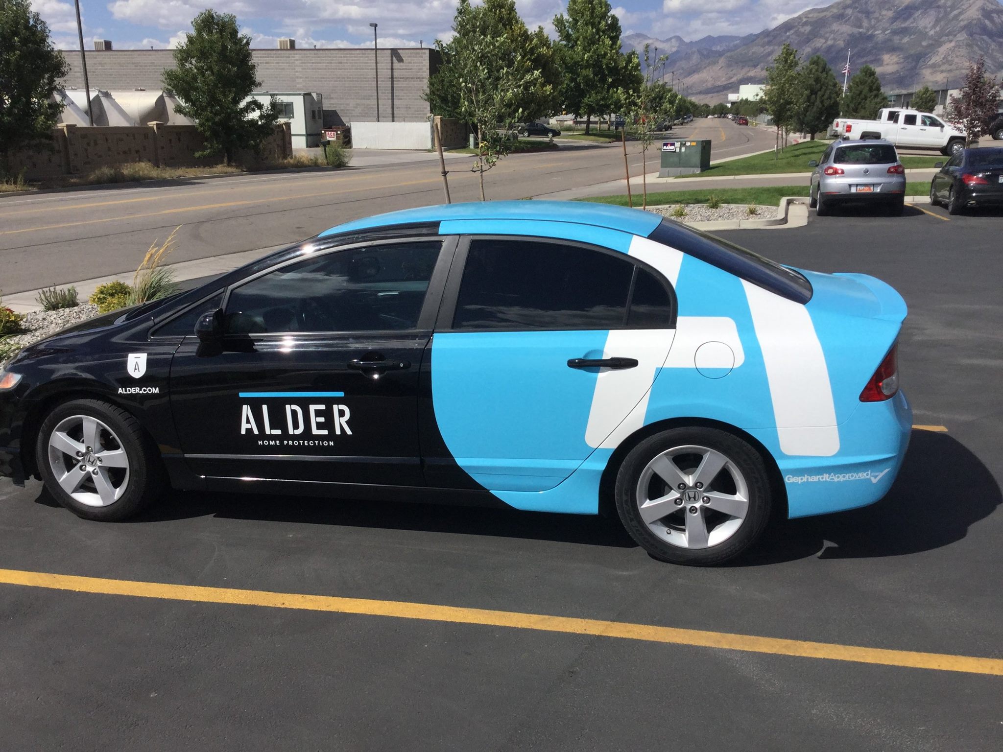 High-impact partial car wrap and vinyl lettering