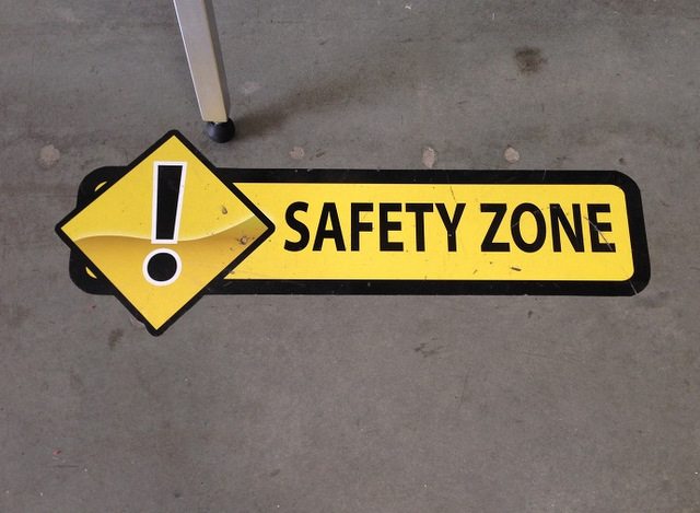 Custom safety graphics marking a pedestrian floor route