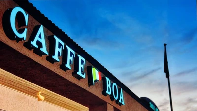 Caffe Boa exterior letters mounted along a brick storefront