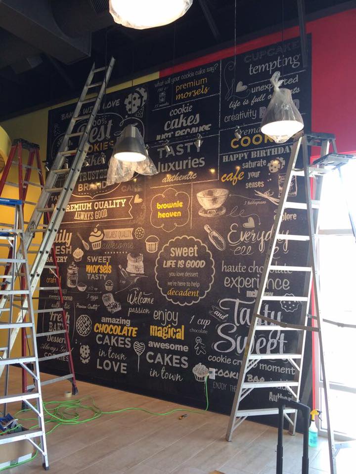 Professional installation of a large custom vinyl mural