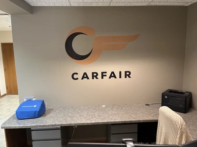 Carfair office lobby with dimensional logo sign above the reception desk