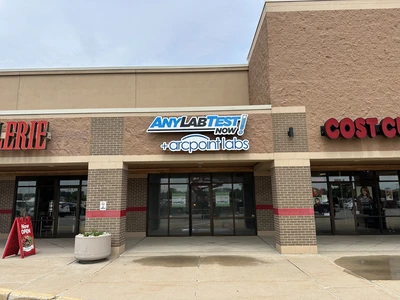 AnyLabTest Now storefront tenant sign installed in a Green Bay plaza