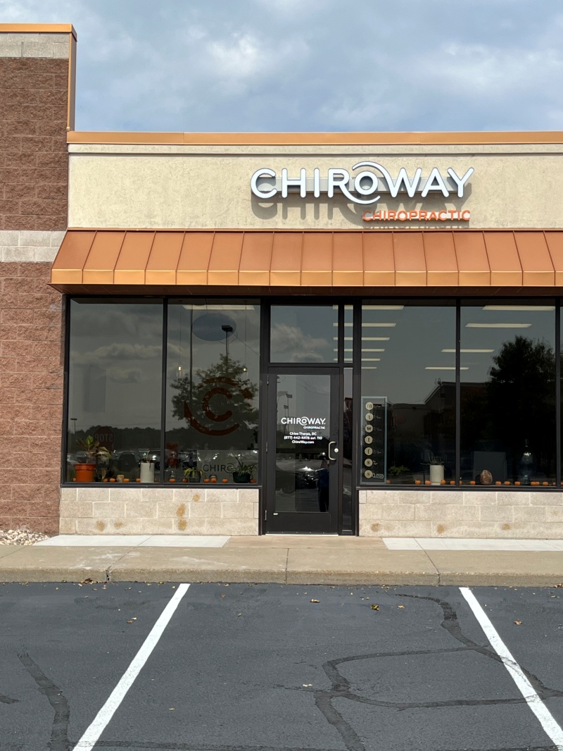 ChiroWay Chiropractic storefront with dimensional channel letter sign and copper awning at dusk, installed by Covenant Signs and Graphics