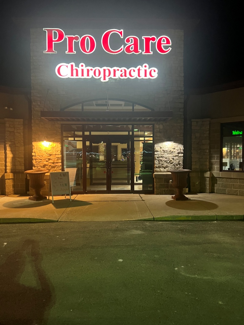 Pro Care Chiropractic halo-lit channel letters glowing red after dark