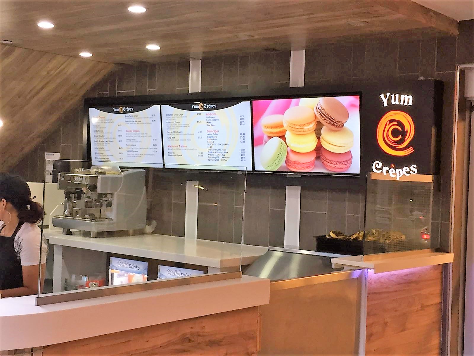 Indoor digital menu boards displaying products and pricing