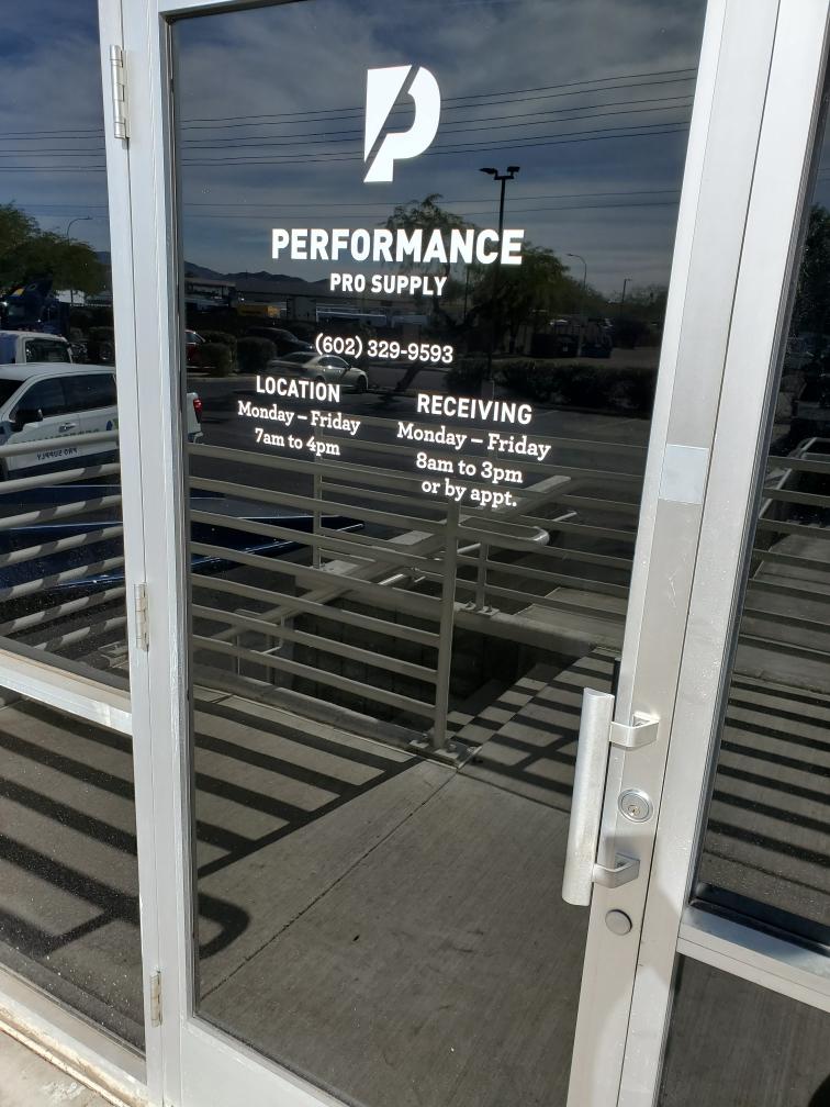 Custom identification sign mounted beside a business door