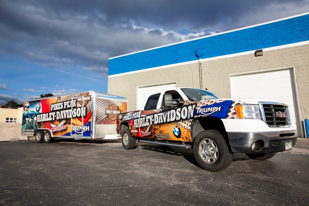 Cohesive vinyl graphics on multiple commercial vehicles