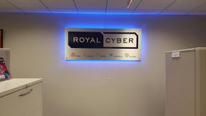 Backlit logo sign installed inside a business lobby