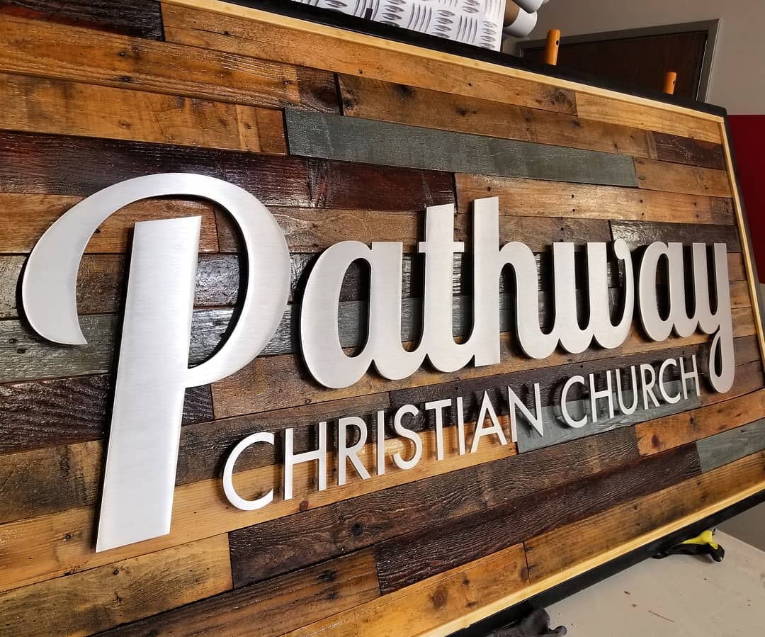 Custom storefront sign with dimensional metal letters