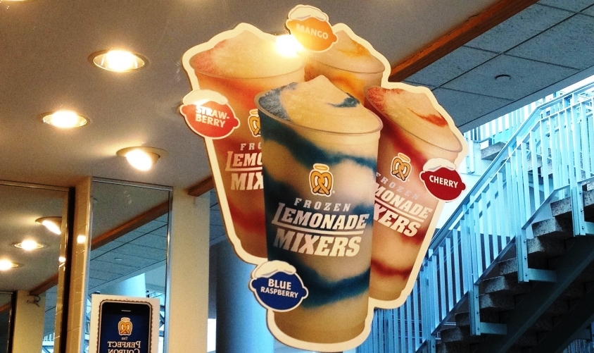 Custom hanging promotional sign inside a business