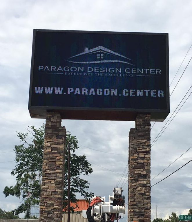 Outdoor pylon sign with a digital message display
