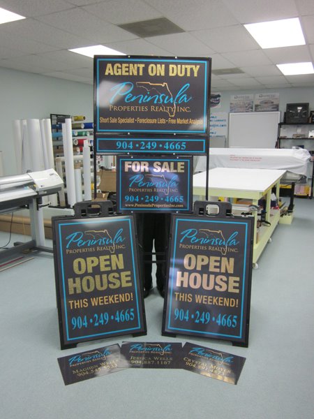 Branded real estate yard sign installed at a property