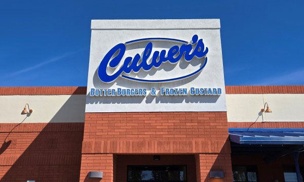 Promotional graphics displayed across a retail storefront