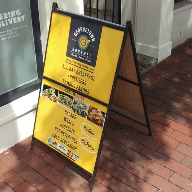 Portable temporary A-frame signs outside a business