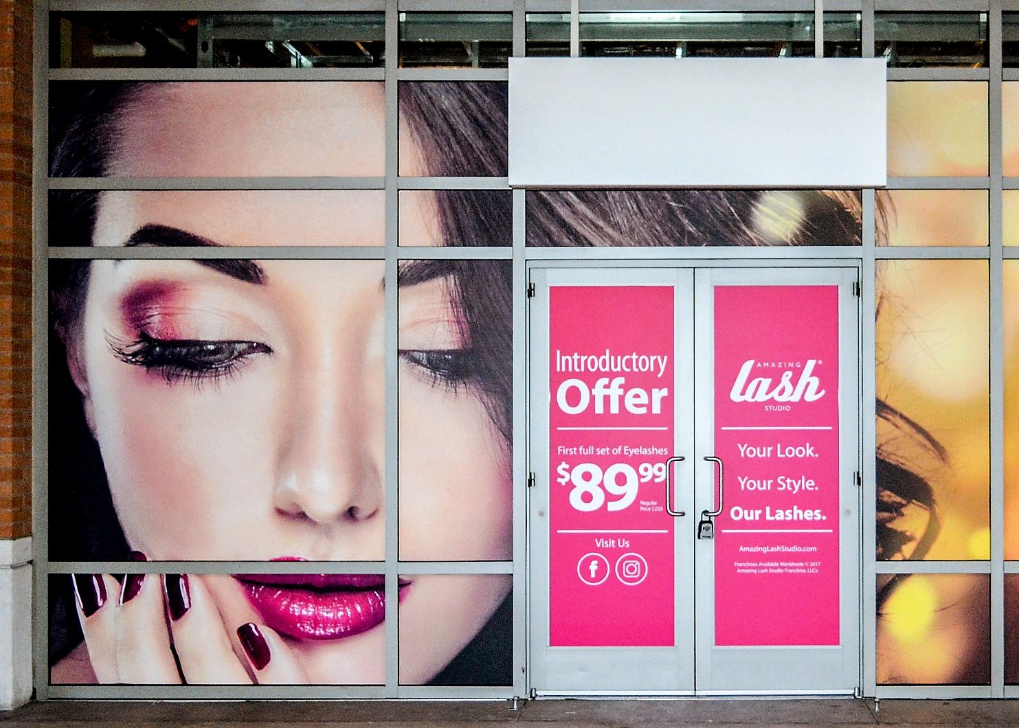 Temporary promotional window graphics on a storefront