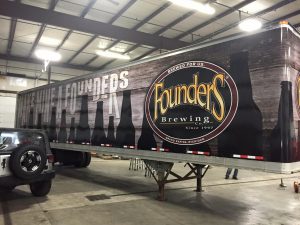 Custom vinyl graphics installed on a semi-trailer
