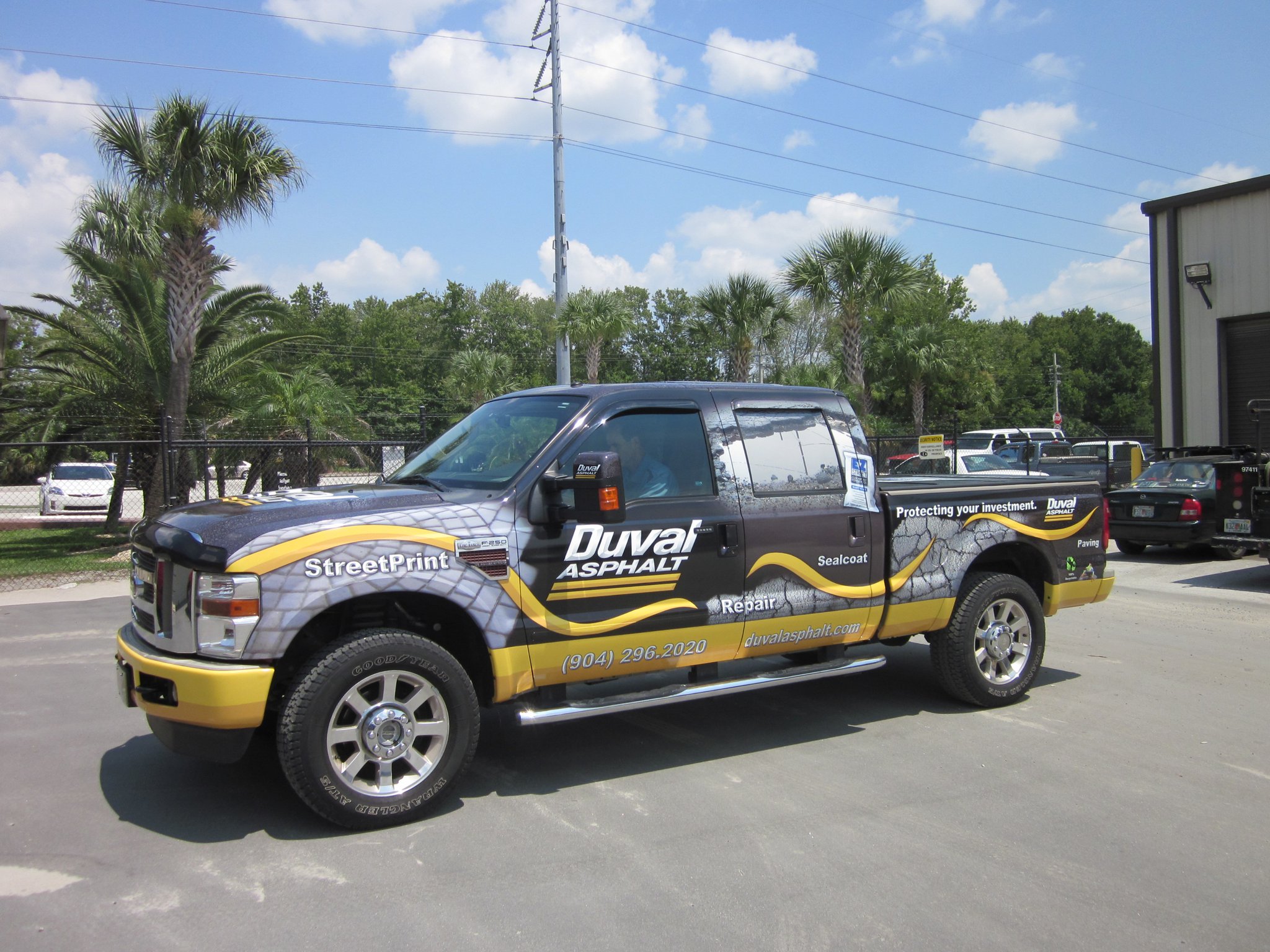Custom branded vinyl wrap on a commercial work truck