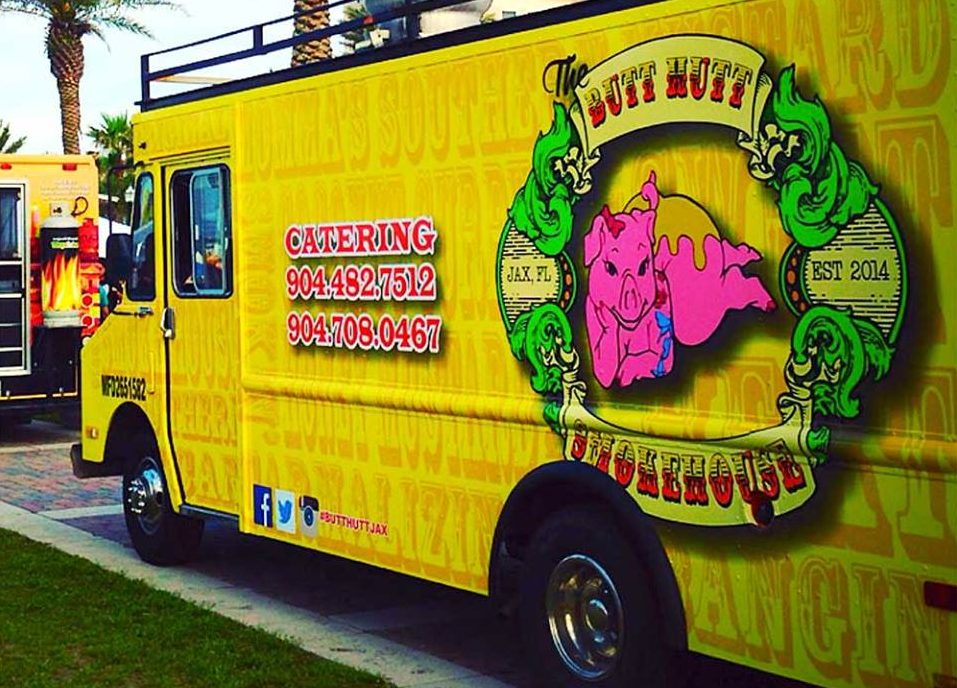 Colorful custom vinyl wrap installed on a food truck