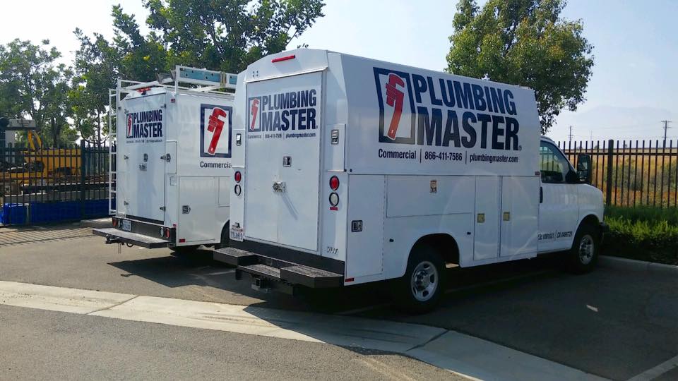 Coordinated commercial fleet with matching vinyl graphics and lettering
