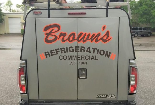 Custom vinyl lettering and graphics on a commercial vehicle