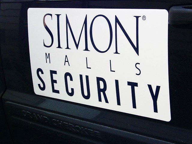 Custom removable business magnet displayed on a car door
