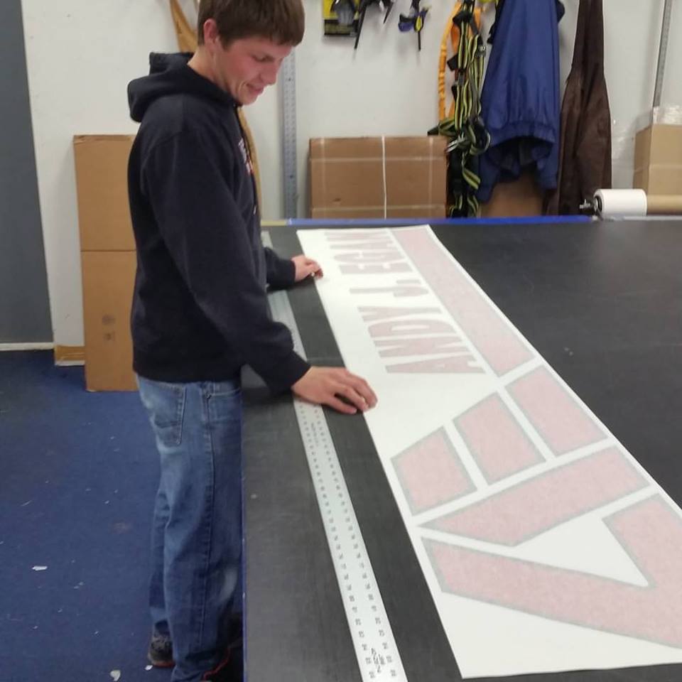 Custom vinyl graphics and lettering prepared for commercial use