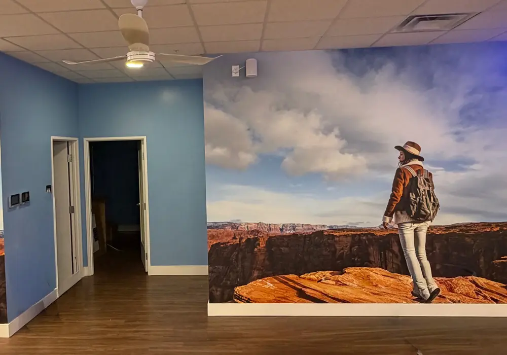 Custom feature-wall mural creating an immersive branded interior