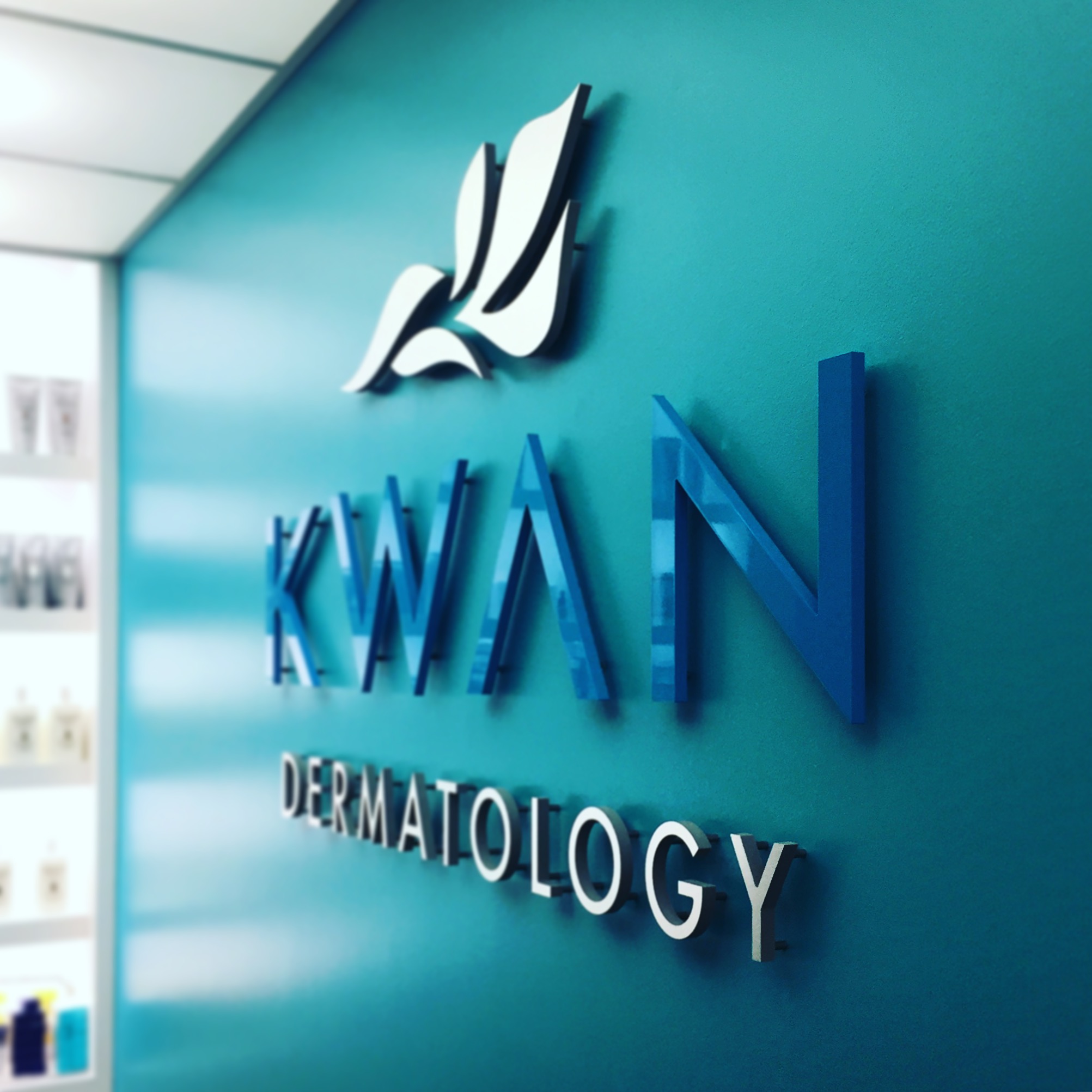 Custom business wall sign mounted as a branded interior feature