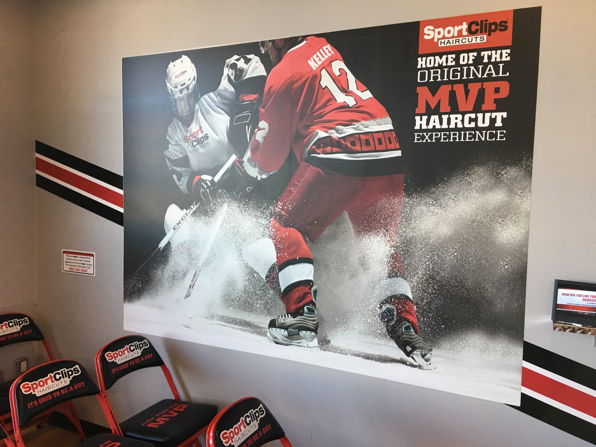 Lobby wall enhanced with a large branded sign and graphic display