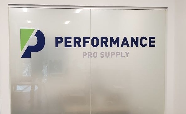 Decorative window film adding branded detail to interior glass