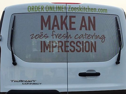 Perforated printed window film applied to vehicle glass