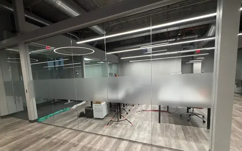 Frosted privacy film installed across office glass panels