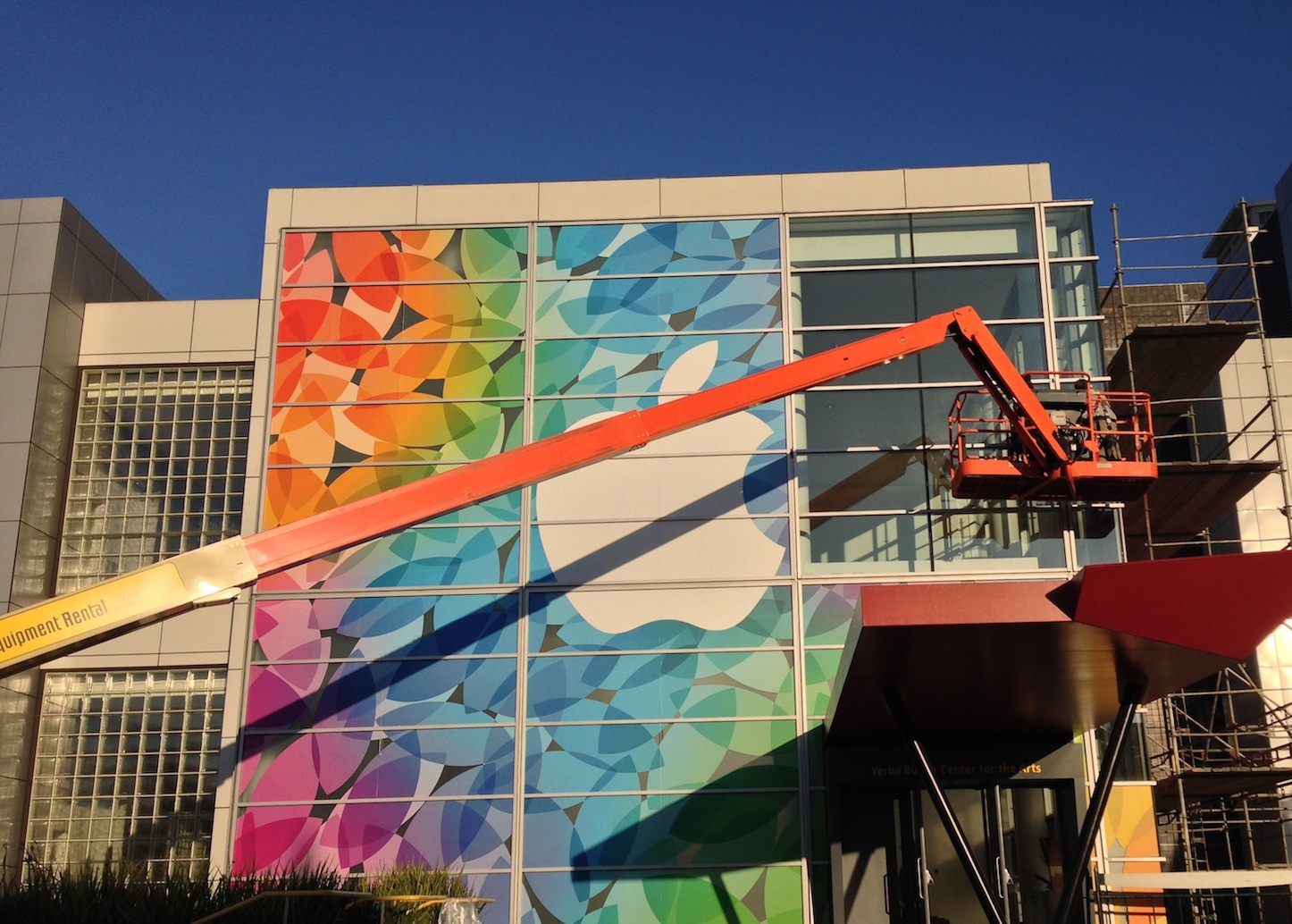 Large-format vinyl display extending across multiple window panels