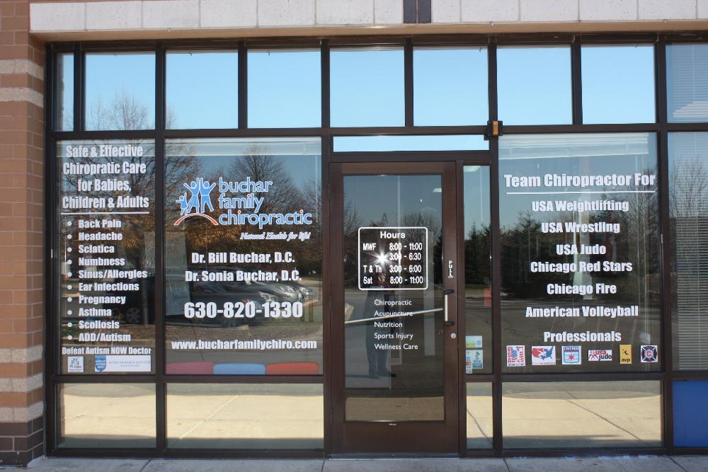 Professional office windows decorated with branded vinyl graphics