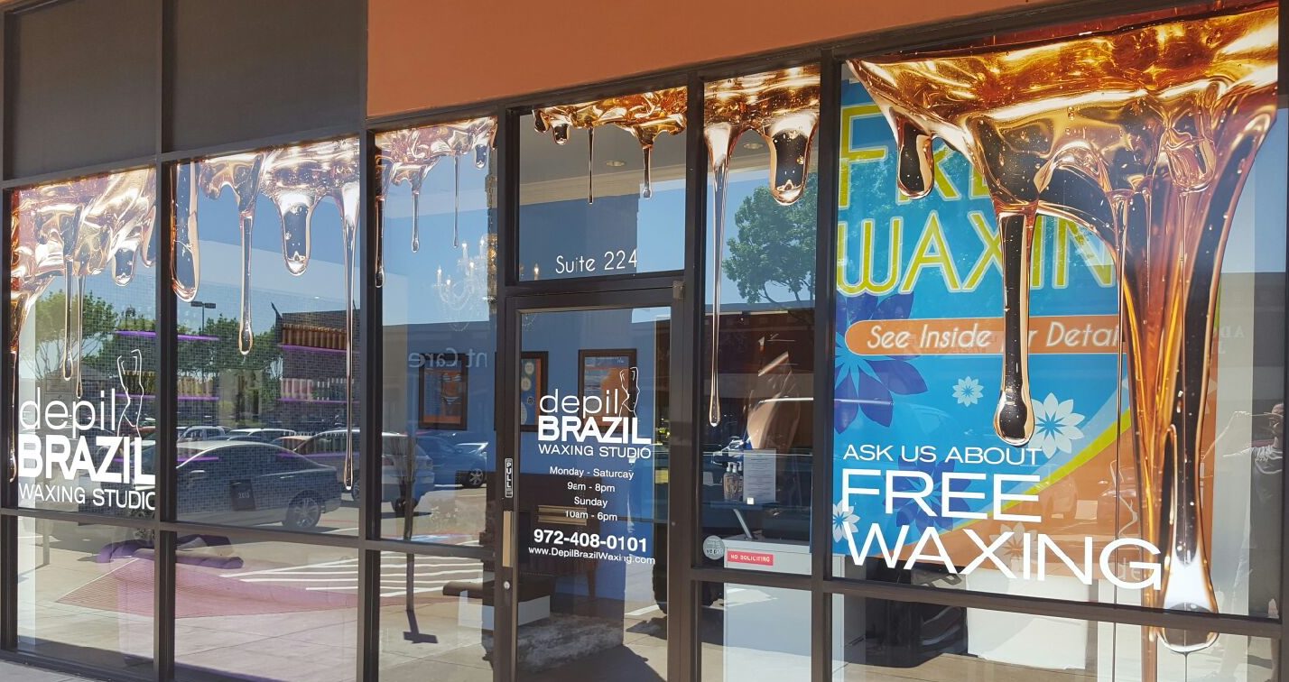 Window sign system combining business lettering and branded graphics